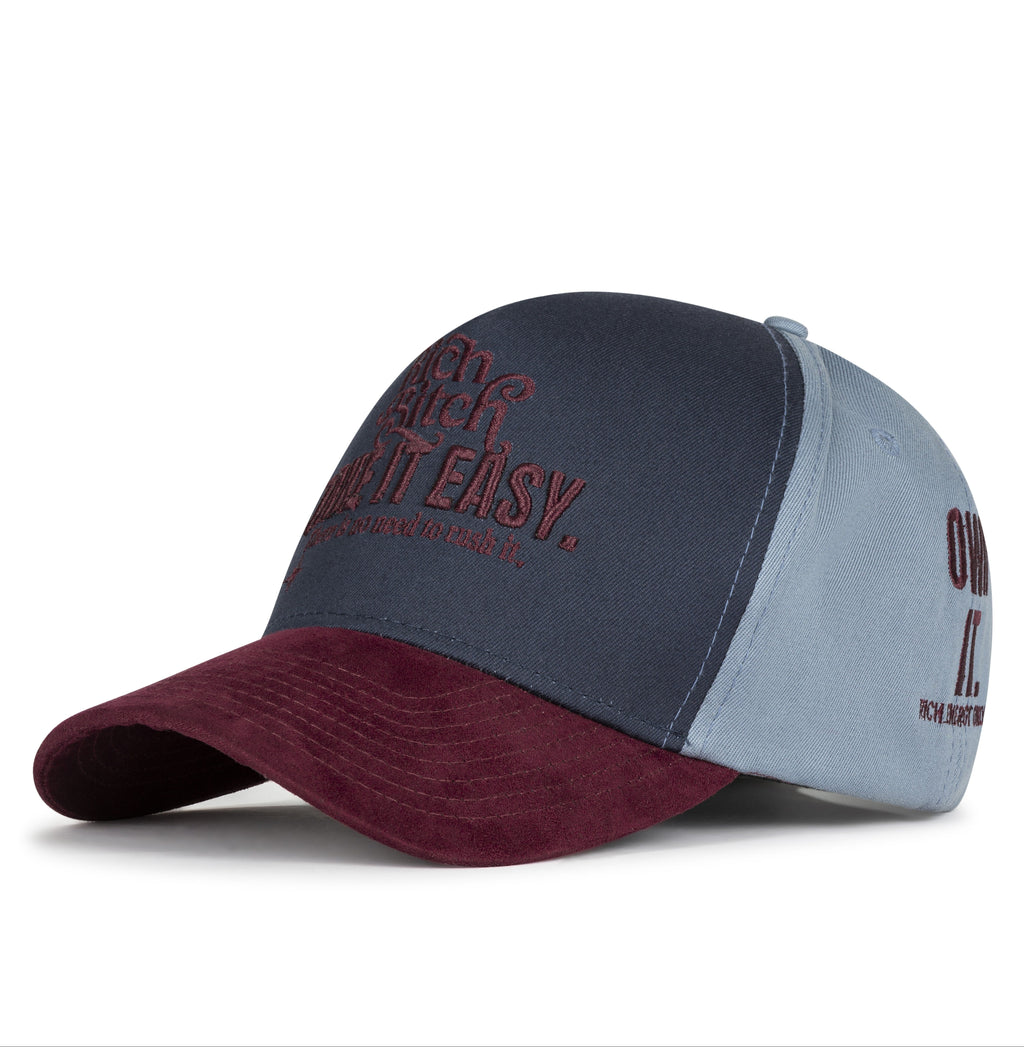 Two-tone cap with maroon and gray design on a white background